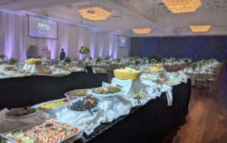 Banquet hall setup with food and tables